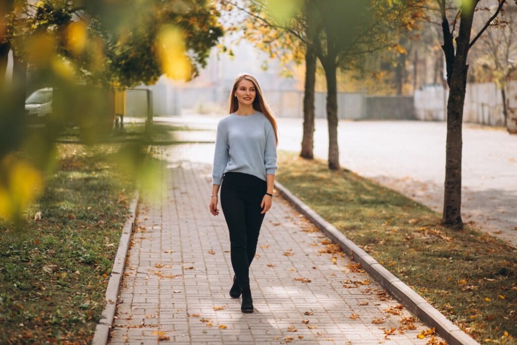 young-woman-walking in the autumn