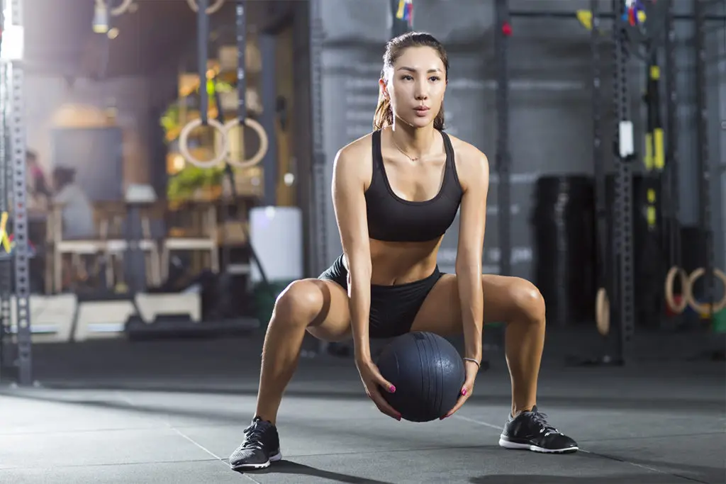 Woman doing recovery workouts instead of gym for better fitness.