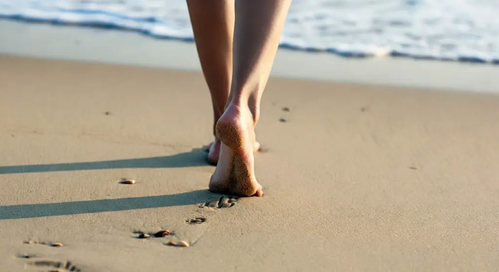 Barefoot walking on the sand.