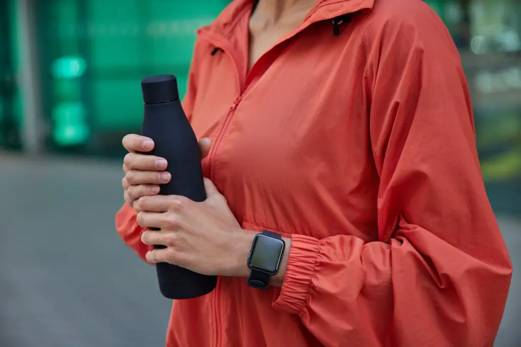 Woman holding the AI-powered smart bottles.